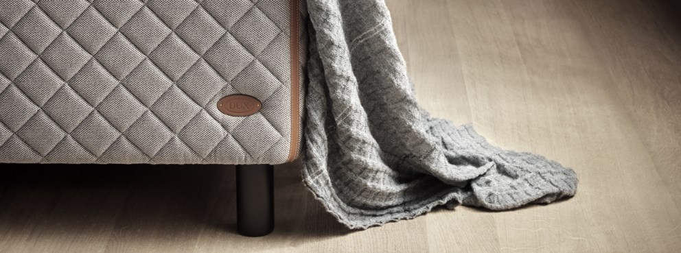 Detailed closeup of the DUX 1002 bed with bedspread